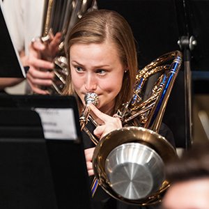 A student plays the trombone