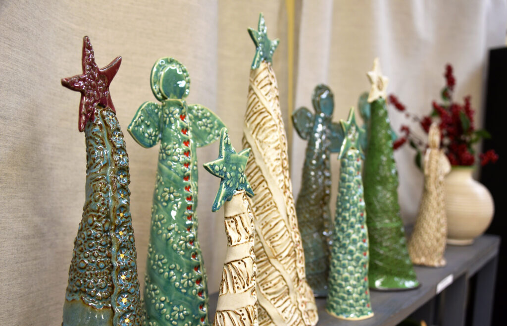 Handmade pottery angels and Christmas trees.