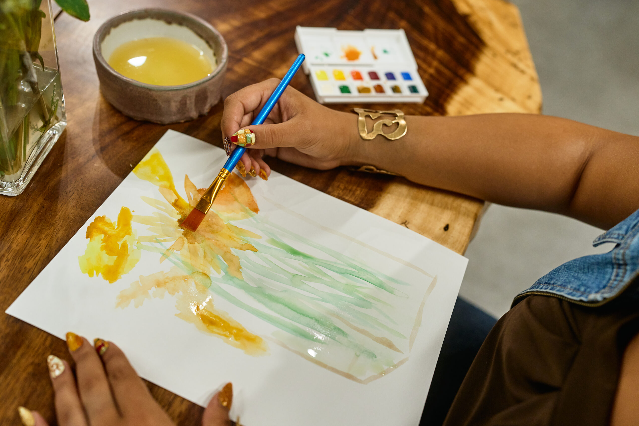A person painting with water colors
